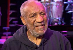 Cosby returns to stage; Protesters outside