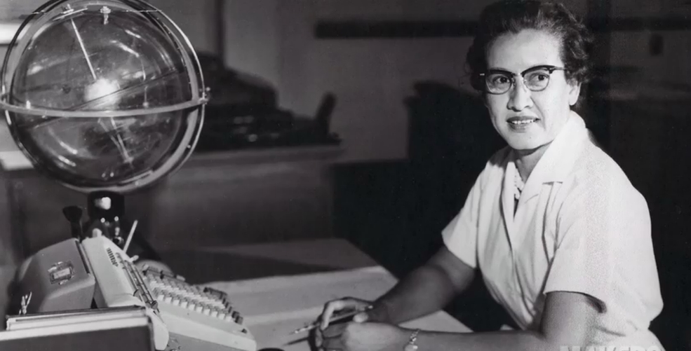 Katherine Johnson sits at her desk with a globe, or "Celestial Training Device." Credit: NASA