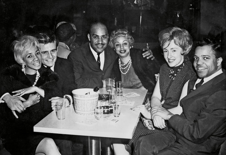 Raynoma Gordy and Barney Ales, left, and Berry Gordy Jr., far right, in a Detroit nightclub around 1960. Credit Barney Ales Collection