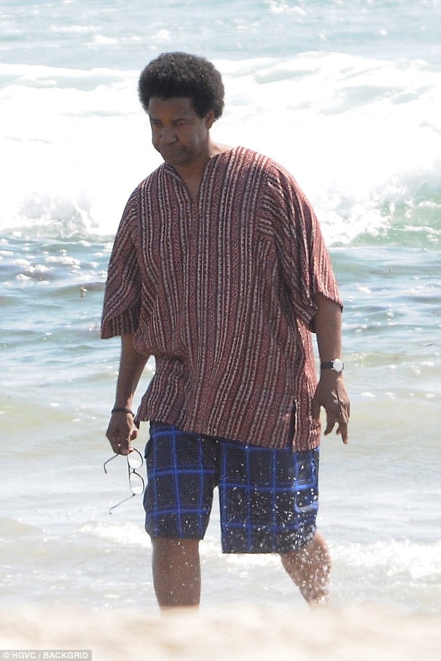 Denzel Washington wades in Pacific Ocean on LA set of legal drama