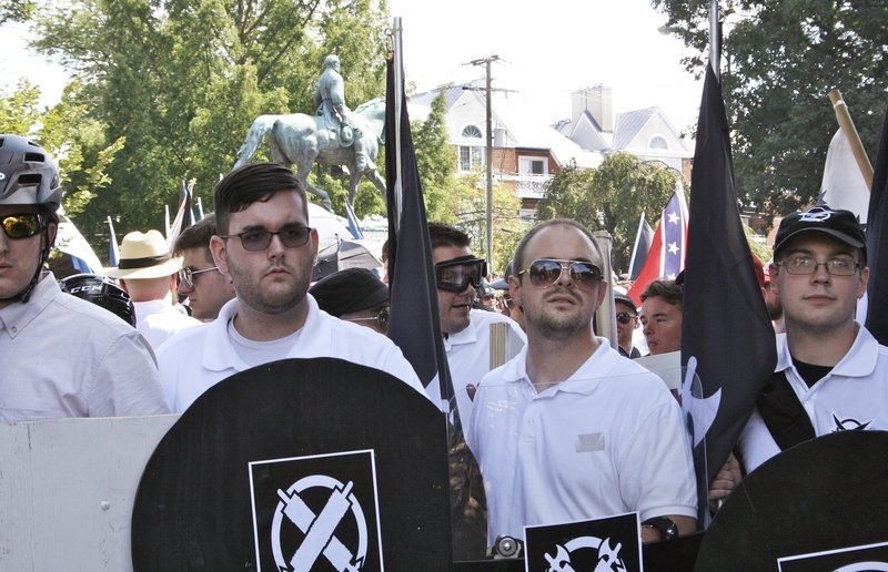 Man accused of ramming protesters pictured with racist group