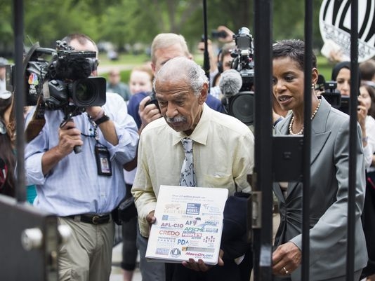 Conyers returns home amid reports that he is being pushed to resign