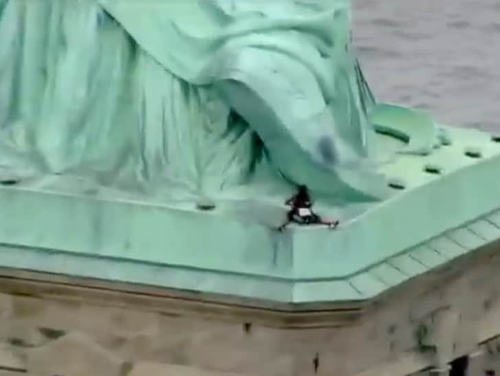 Statue of Liberty Scaled By Woman on 4th of July