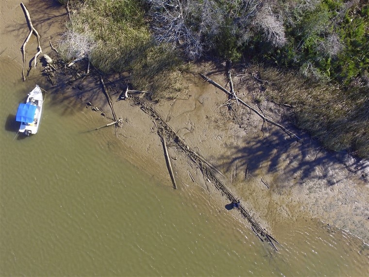 Image: The remains of a ship that could be the Clotilda, the last slave ship documented to have illegally transported captive Africans to the United States Aerial photo over Mobile County, Alabama, last year shows the remains of the Clotilda, the last sla