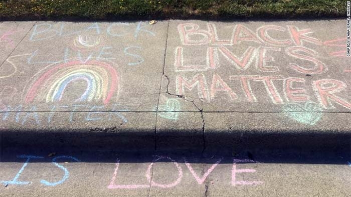 After a White man repeatedly erased girl’s ‘Black Lives Matter’ chalk drawing in front of her home, neighbors stepped in to show support