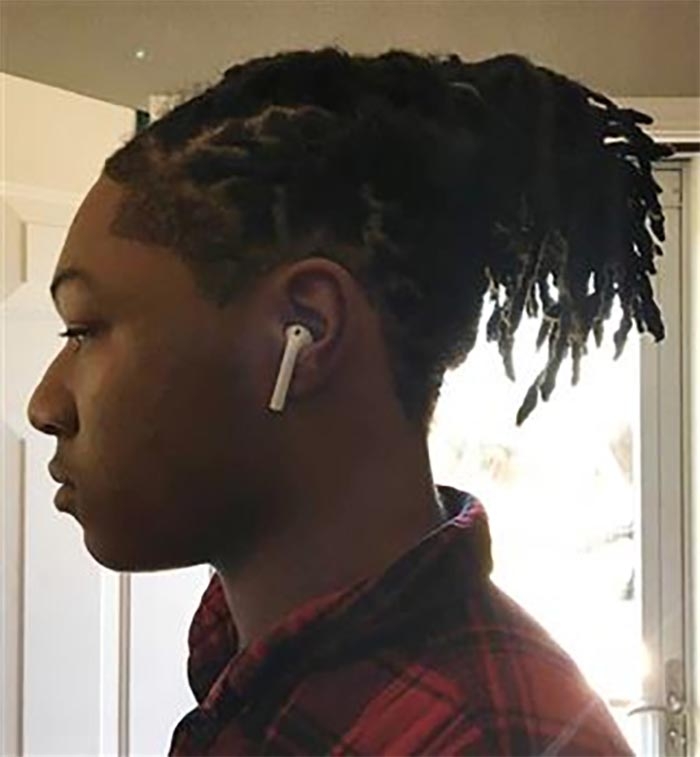 Black teen told to cut his locs by Texas school wins court ruling