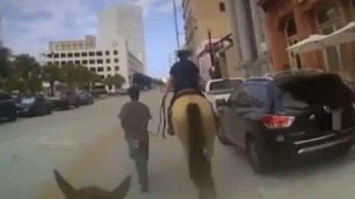 Black man led by white police on horseback sues for $1m