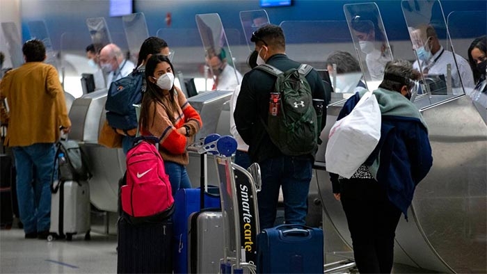 Americans warned against travel as COVID variants spread and testing rules go into effect