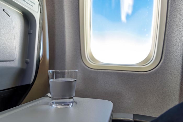 Flight Attendant Reveals the Gross Reason You Should Never Drink Water on Planes in Viral TikTok