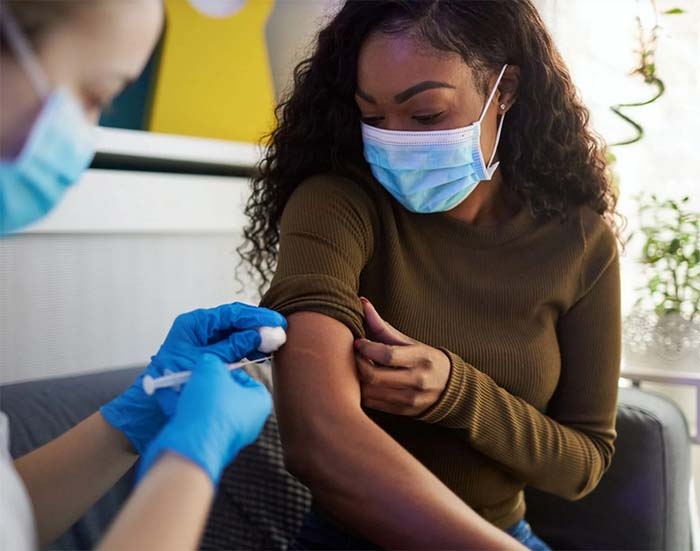 Here’s Why Women Are Experiencing More Extreme Vaccine Side Effects Than Men