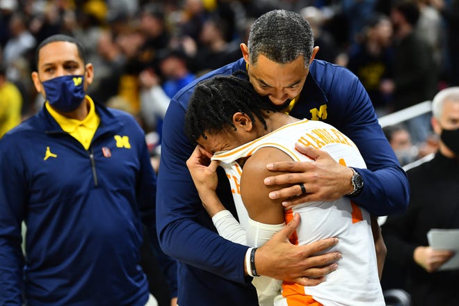 Michigan coach Juwan Howard comforts crying Tennessee star Kennedy Chandler