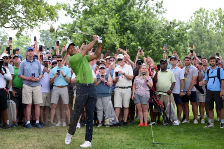 Remember the no-phone guy watching Tiger Woods? He signed a merchandise deal with Michelob Ultra
